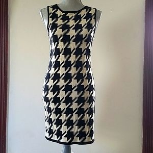 Calvin klein dress very stylis black and white have somes small holes.